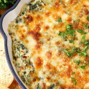 Skillet Spinach Artichoke Dip is a hot dip recipe topped with cheese and baked